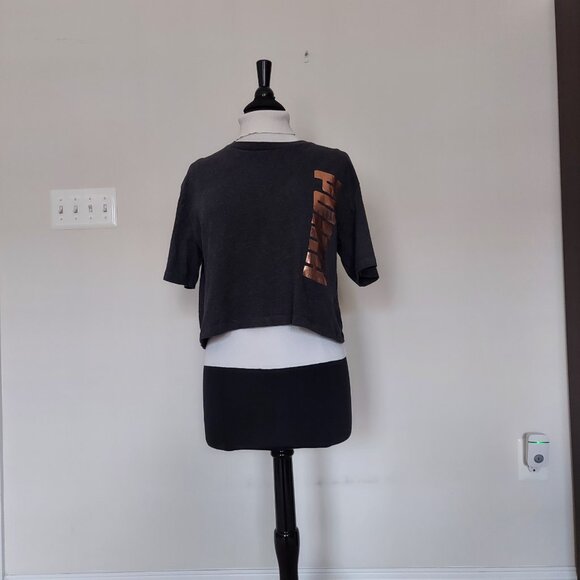 Puma women's cropped t-shirt with a rose gold vertical logo.  Sz L. Cotton mix. - Picture 3 of 4